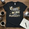 Coffee Makes Me Feel Less Murdery quote on a black t-shirt with gold wings and coffee cup graphic