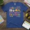 T-shirt with "COMMUNICATION looks different FOR EVERYONE" text and graphics representing diverse communication methods like ASL and AAC devices