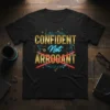 CONFIDENT Not ARROGANT quote t-shirt with gold and neon blue text, featuring red cross-out lines