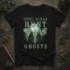 Cool Girls Hunt Ghosts t-shirt design with three cloaked figures holding glowing staffs amidst smoky ghosts and a full moon
