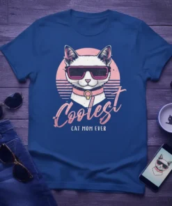 Coolest Cat Mom Ever t-shirt featuring a white cat wearing sunglasses and a pink collar with retro sunset design