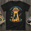 Cosmic Cat Abduction Society t-shirt design with a black cat, UFO, aliens, and planets in a colorful space theme