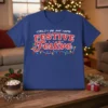 Blue t-shirt with red and white text that reads "COULD I BE ANY MORE FESTIVE Festive" and colorful Christmas lights