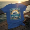 Blue t-shirt featuring "Countdown Is Over It's Cruise TIME!" text with a cruise ship, ocean, palm trees, and anchor graphic