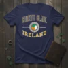 Navy blue t-shirt with "County Clare Ireland" text, a Celtic knot emblem, and the Irish flag colors