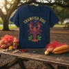 Navy t-shirt with "CRAWFISH BOIL" text and a graphic of a red crawfish with green leaves
