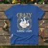 Crazy Goose Lady t-shirt design with three cartoon geese wearing glasses in a circular feather motif