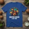 Crested Gecko I See You! text on a royal blue t-shirt with three orange crested geckos and green leaves graphic
