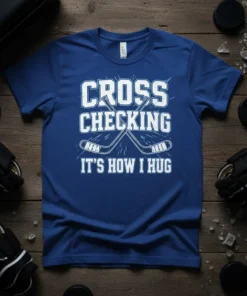 Blue t-shirt with white text "CROSS CHECKING IT'S HOW I HUG" and crossed hockey sticks graphic