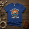 Cruising my way INTO 50 t-shirt with a cruise ship, palm trees, and sunset graphic, celebrating a 50th birthday