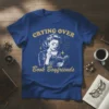 Crying Over Book Boyfriends T-Shirt featuring a vintage woman reading and drinking tea, with stars and constellations, in yellow text