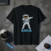 Black t-shirt with a dabbing astronaut graphic and "Dab Bin Dogs" text in neon blue