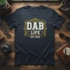Dab Life Est. 2024 t-shirt design with distressed white text inside an ornate gold frame