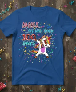 Dabbing unicorn graphic with "DABBED... MY WAY THRU 100 DAYS" text on a blue t-shirt, celebrating 100 days of school