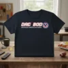 Dad Bod Average American Hero text with shield graphic on a navy blue t-shirt