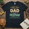 I Have Two Titles Dad And Peepaw & I Rock Them Both text design on a dark navy t-shirt, vintage