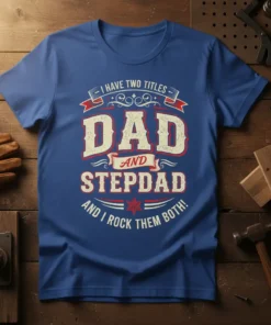 I Have Two Titles Dad and Stepdad And I Rock Them Both quote on a blue t-shirt, vintage distressed font