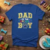 Dad of the Birthday Boy t-shirt with gold glitter text and a blue paw print graphic