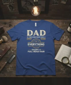 DAD THE MAN WHO HAS EVERYTHING EXCEPT A FULL HEAD HAIR quote on a blue t-shirt, featuring vintage distressed typography