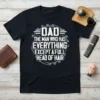 Dad The Man Who Has Everything Except A Full Head of Hair quote on a black t-shirt, with gear graphics