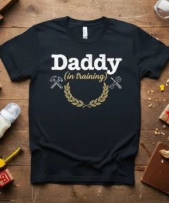 Daddy in training quote with hammer and wrench graphics on a black t-shirt, ideal for new dads