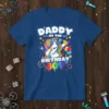 Daddy of the Birthday Boy text with a dabbing unicorn graphic and party elements on a blue t-shirt