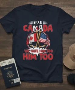 T-shirt with "Dear Canada We Hate Him Too Him Too" text, Canadian and US flags, and crossed hockey sticks graphic
