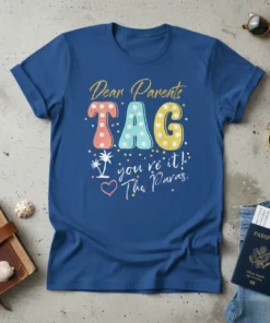 Blue t-shirt with colorful "Dear Parents TAG you're it! The Paras," vacation quote design, featuring palm trees and confetti