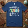 DEAR PARENTS, TAG! you're IT -teachers quote on a navy blue t-shirt with colorful lettering and peace sign graphic