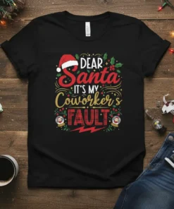 Black t-shirt with "Dear Santa It's My Coworker's Fault" text in festive red and gold, featuring Santa hat and Christmas