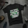 Black t-shirt with bold white and green text: "DEAR TRAINER PLEASE DON'T KILL ME TODAY" quote for gym humor