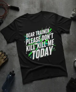 Black t-shirt with bold white and green text: "DEAR TRAINER PLEASE DON'T KILL ME TODAY" quote for gym humor