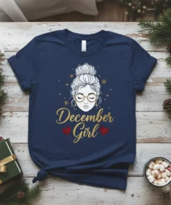 December Girl t-shirt design with gold glitter text and a woman's face graphic, adorned with snowflakes