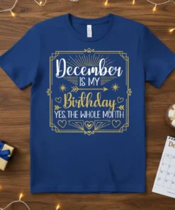 December IS MY Birthday YES, THE WHOLE MONTH text in white and gold on a blue t-shirt, with decorative borders