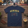 Desi Me Rollin text above a stylized auto rickshaw graphic on a navy blue t-shirt