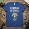 Destroy The Patriarchy Not The Planet text on a blue t-shirt with a raised fist holding a lotus flower within