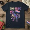 Dino Pride t-shirt with a colorful T-Rex dinosaur holding a bisexual pride flag, surrounded by cosmic swirls and stars