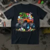 Dinosaur Easter Monster Truck Tee featuring a green T-Rex in sunglasses on an orange monster truck with Easter eggs and