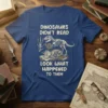 Dinosaurs Didn't Read Look What Happened To Them text with T-Rex and Triceratops skeletons reading books