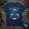 Dinosaurs Eat Man Woman Inherits The Earth quote with two T-Rex heads and floral wreath design on a navy t-shirt