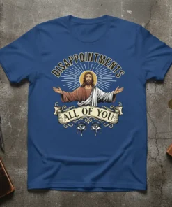 Jesus Christ graphic with "Disappointments All Of You" text on a blue t-shirt, featuring sunburst and eyes design