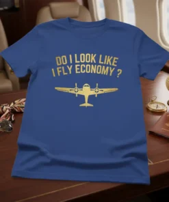 Blue t-shirt with gold text "Do I Look Like I Fly Economy?" and a gold airplane graphic