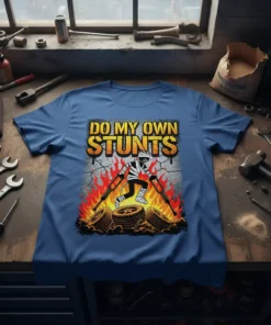 Do My Own Stunts t-shirt featuring a mummy-like figure on crutches amidst flames and tires