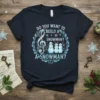Do You Want To Build A Snowman? Christmas t-shirt with musical notes, snowmen, and treble clef graphic