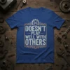 Doesn't Play Well With Others quote on a blue t-shirt with wrench and gear graphic, mechanic humor design