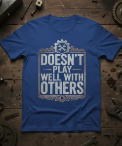 Doesn't Play Well With Others quote on a blue t-shirt with wrench and gear graphic, mechanic humor design