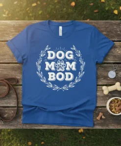Blue t-shirt with white "Dog Mom Bod" text and a paw print graphic, surrounded by a laurel wreath design
