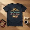 Doing Pilates and Petting All the Dogs t-shirt with a pilates silhouette, dogs, and paw prints