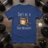Don't Be A D Rack Your Weights funny gym t-shirt with a brown paper lunch bag on a weight rack