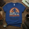 Don't Be An Assquatch Bigfoot T-Shirt with vintage sunset and mountain graphic